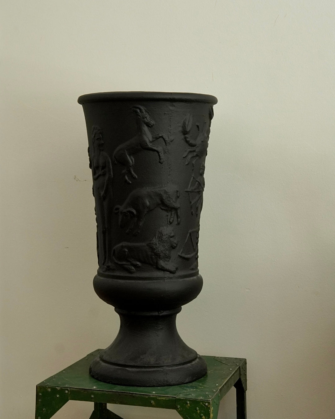 Black concrete vase with horoscope details