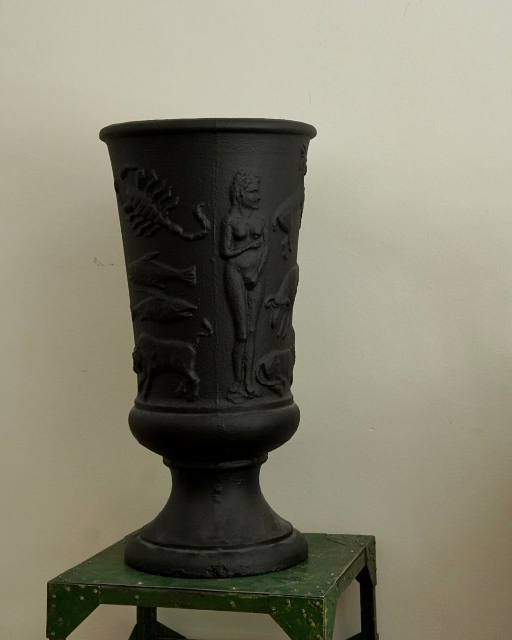 Black concrete vase with horoscope details