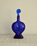 Blue heart shaped bottle with spiral topper/stopper