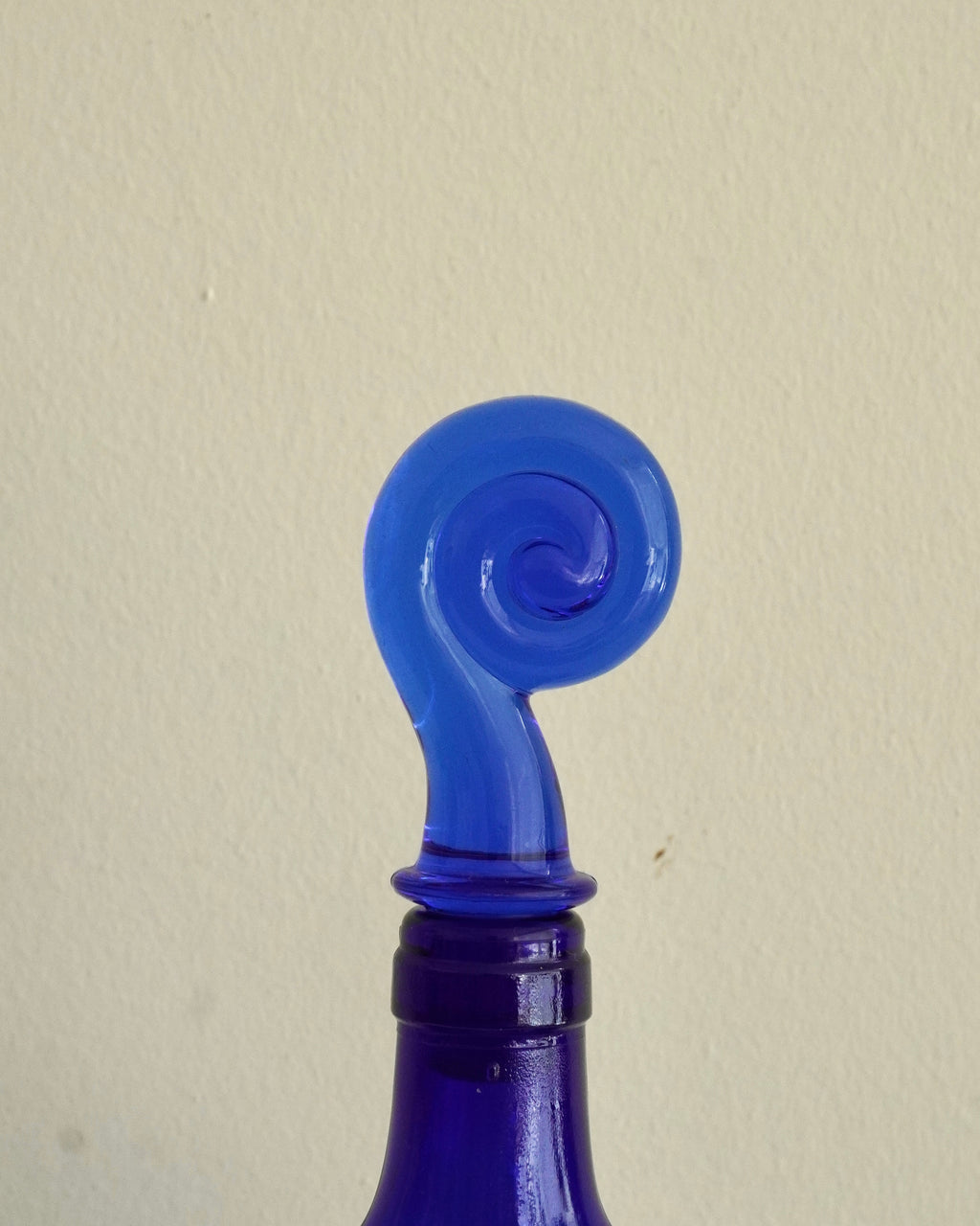 Blue heart shaped bottle with spiral topper/stopper