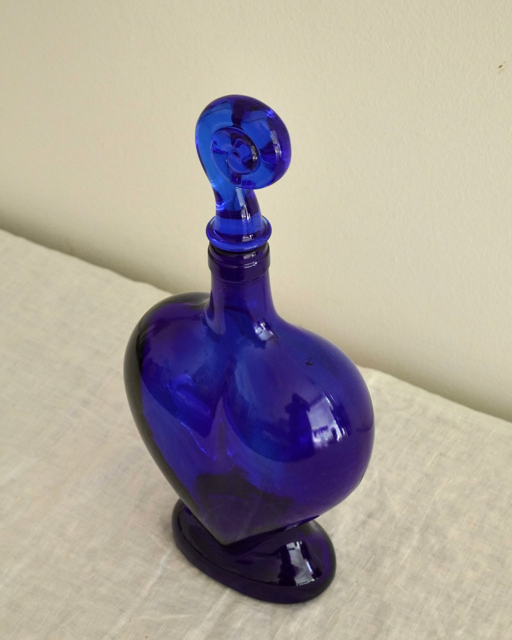 Blue heart shaped bottle with spiral topper/stopper