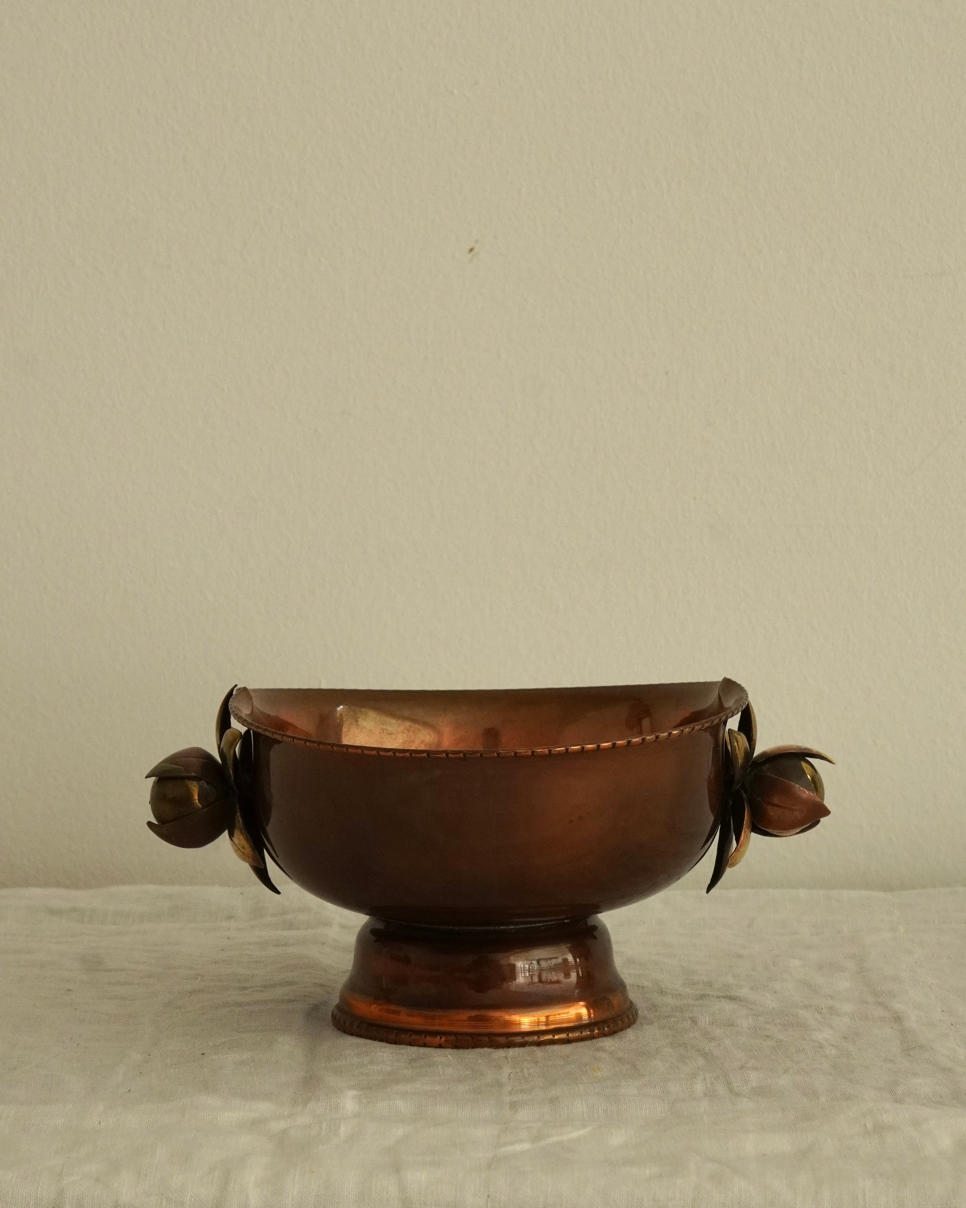 Copper bowl with flower handles