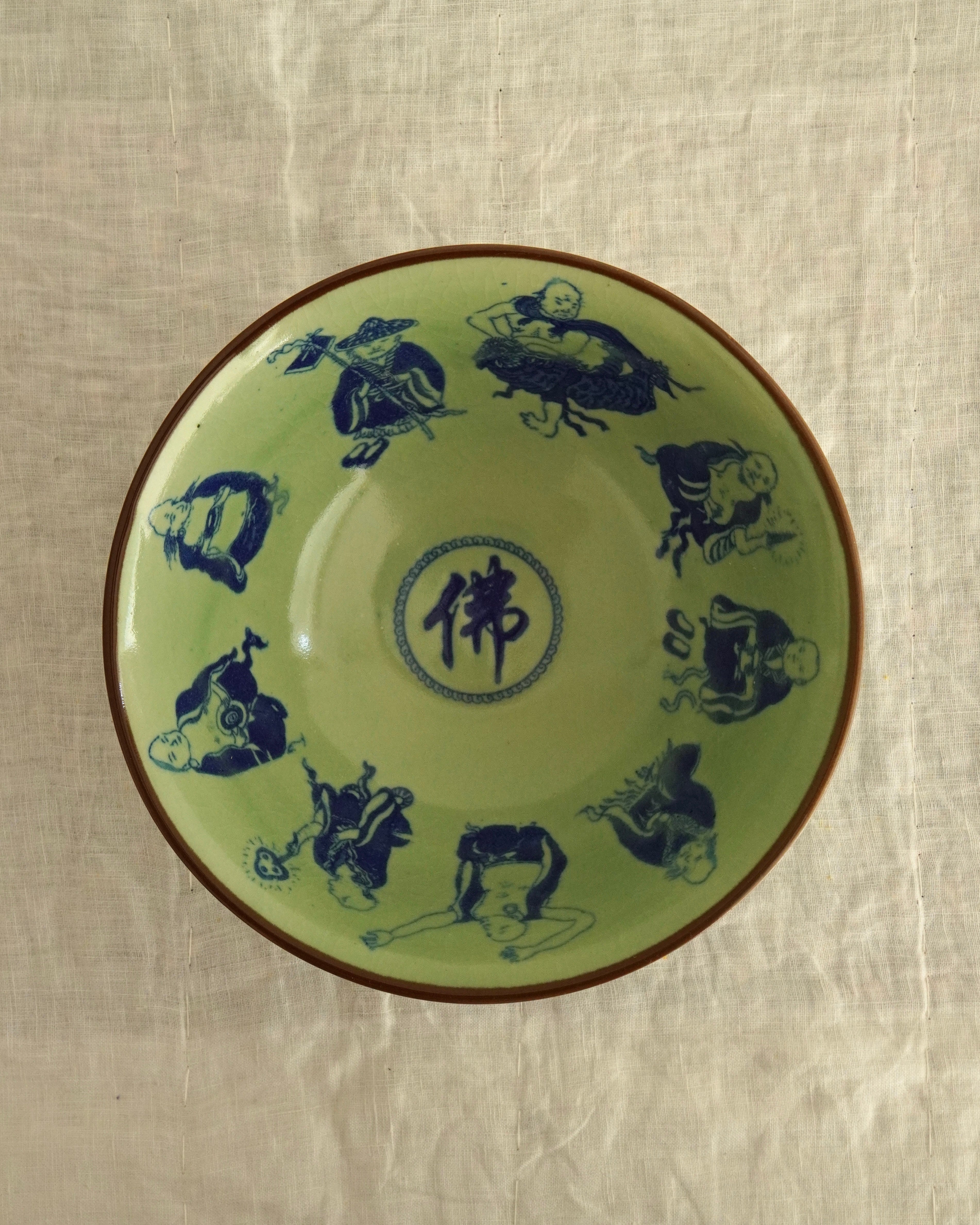 Chinese celadon & blue porcelain bowl with 9 monks