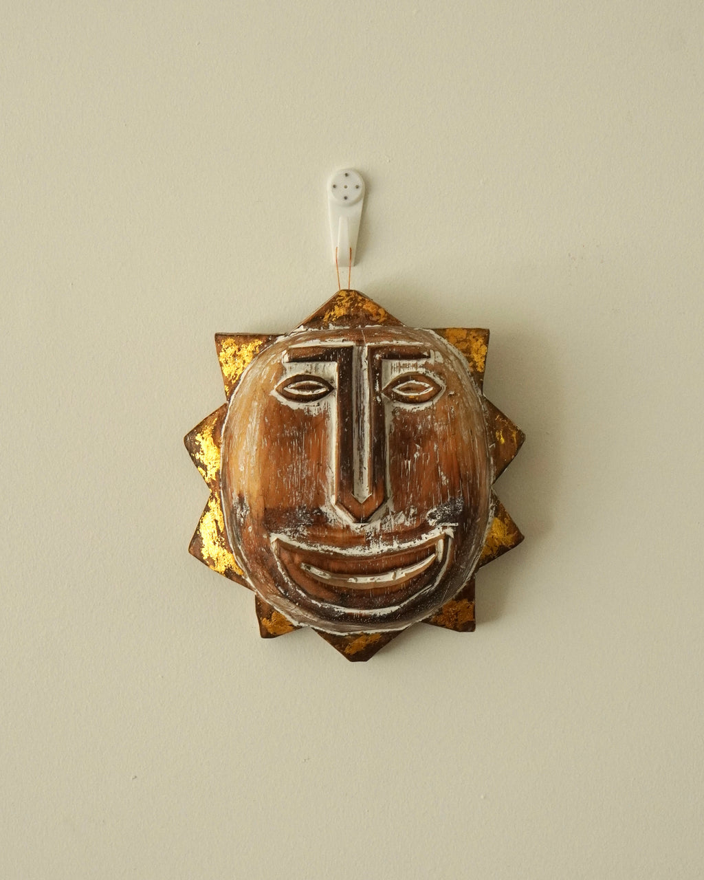 Carved wooden sun smiley face wall hanging