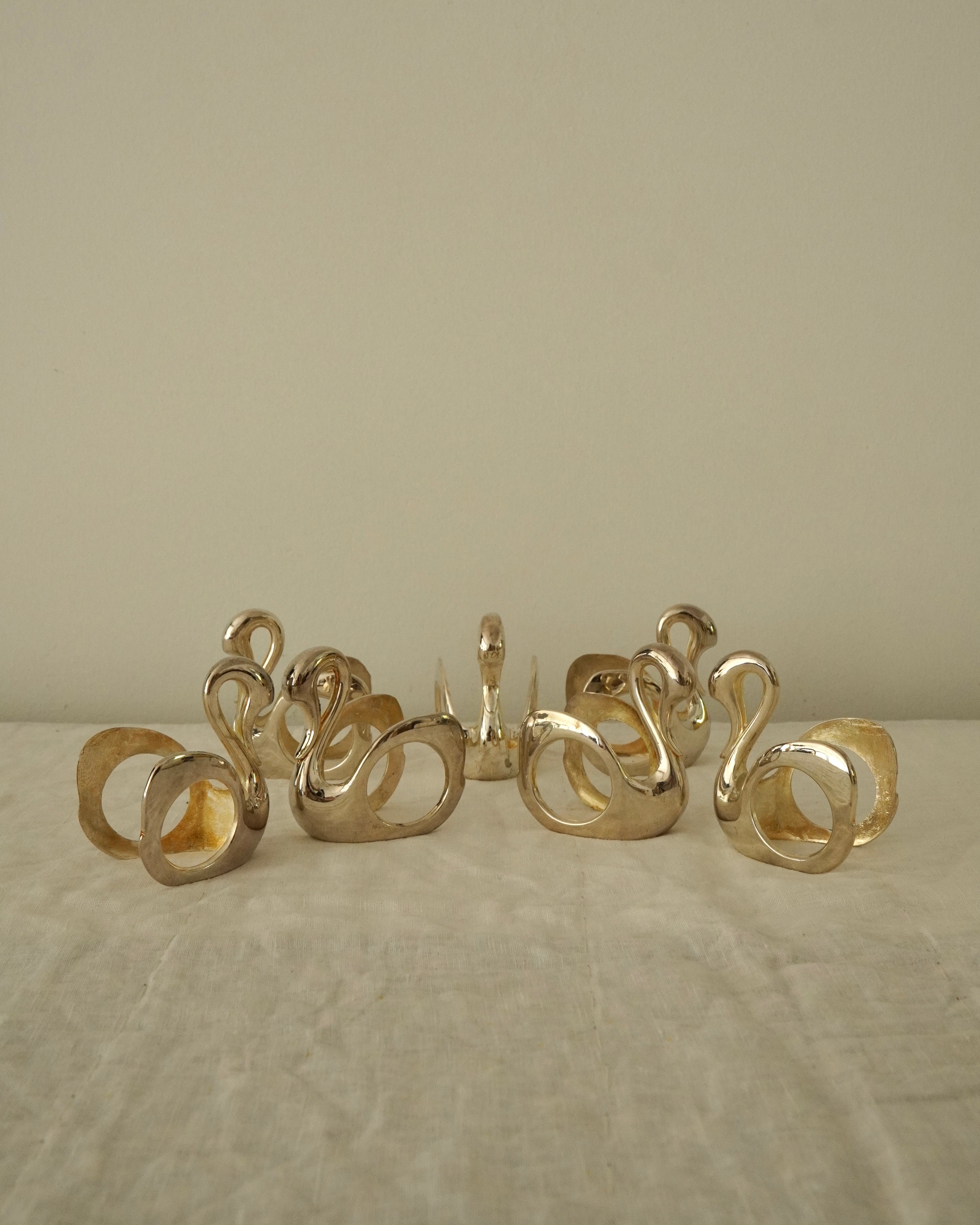 Set of 7 silver plated swan napkin holders
