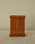 Tramp art storage box in the design of a wardrobe