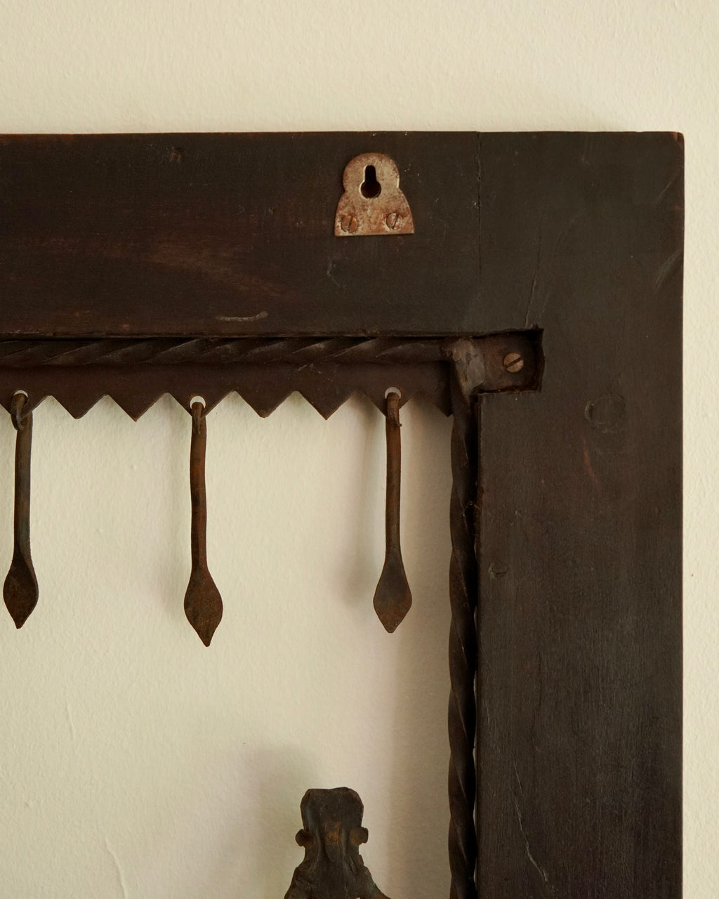 Ethnographic wall mounted panel featuring wrought iron animal and human figures