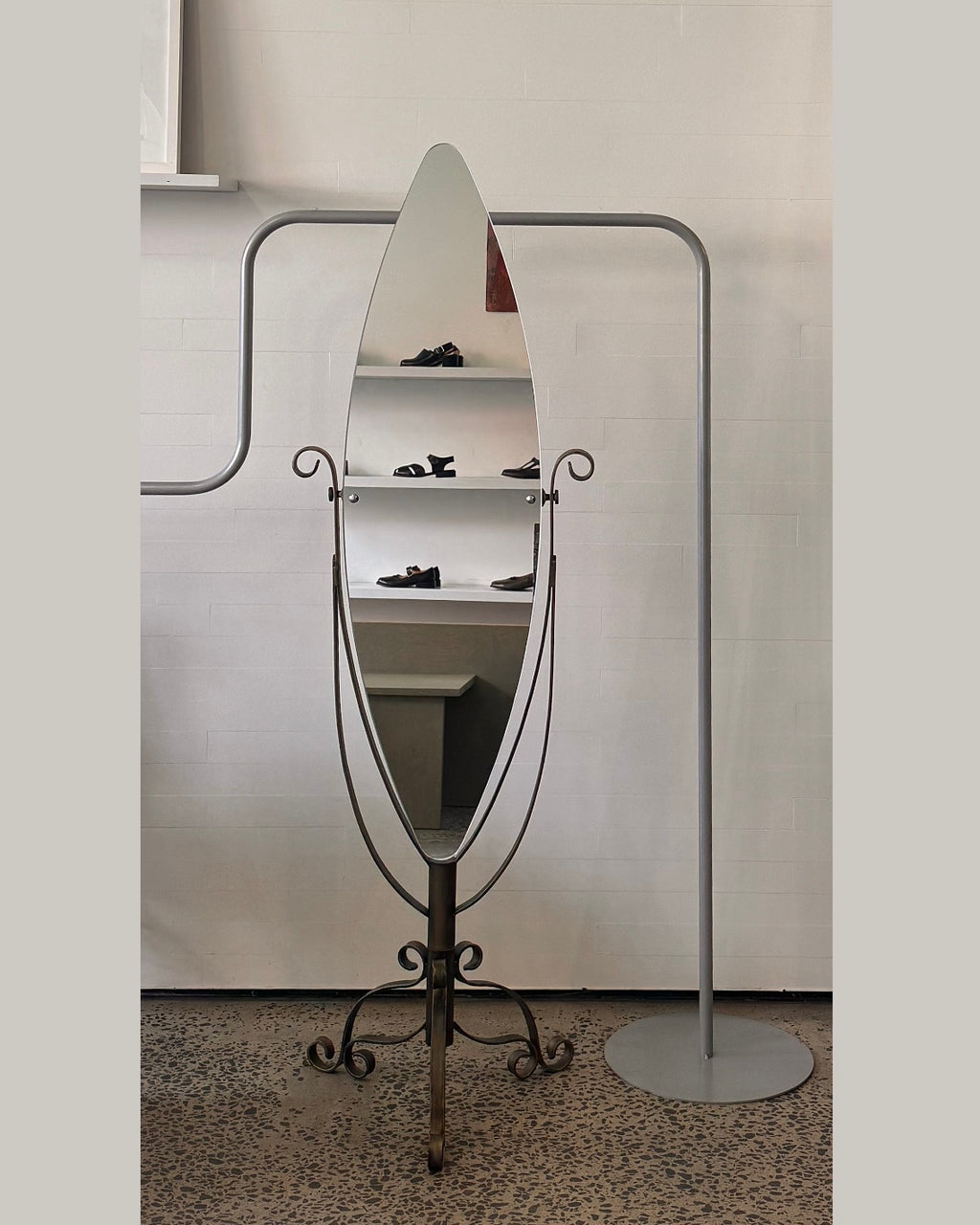 Full length swivel mirror on metal body with bronzed finish and spiral details