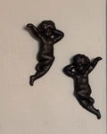 Pair of cast iron angel wall hangings
