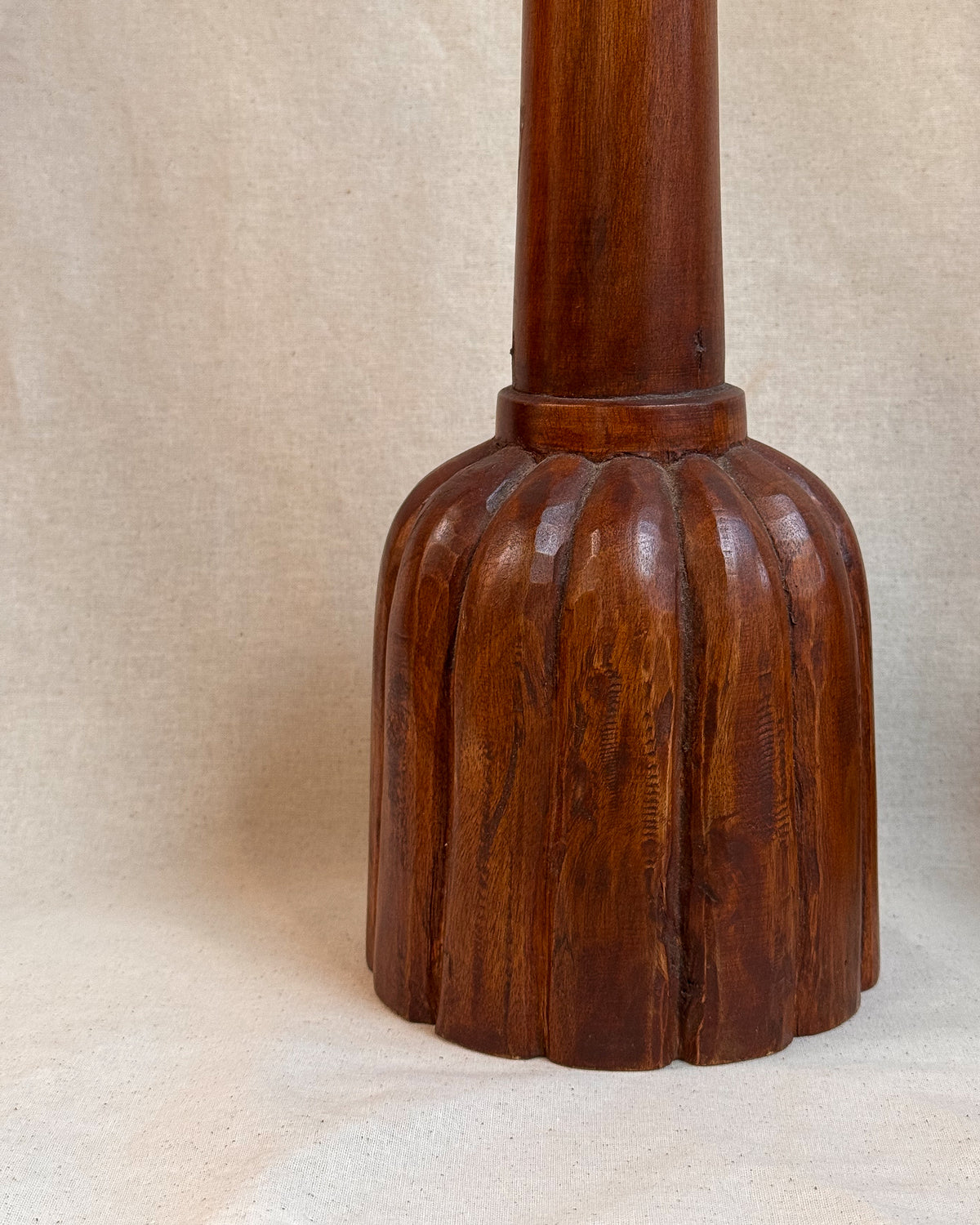 Carved wooden candle holders with canele shaped bases