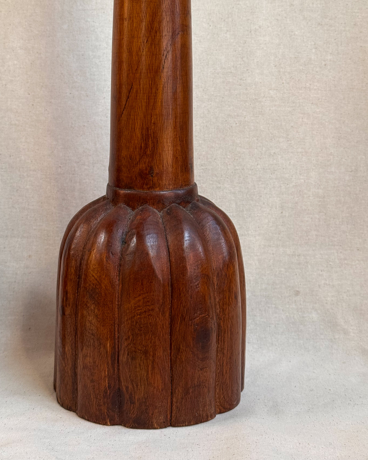 Carved wooden candle holders with canele shaped bases