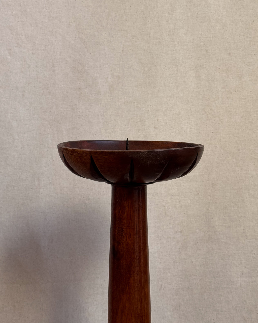 Carved wooden candle holders with canele shaped bases