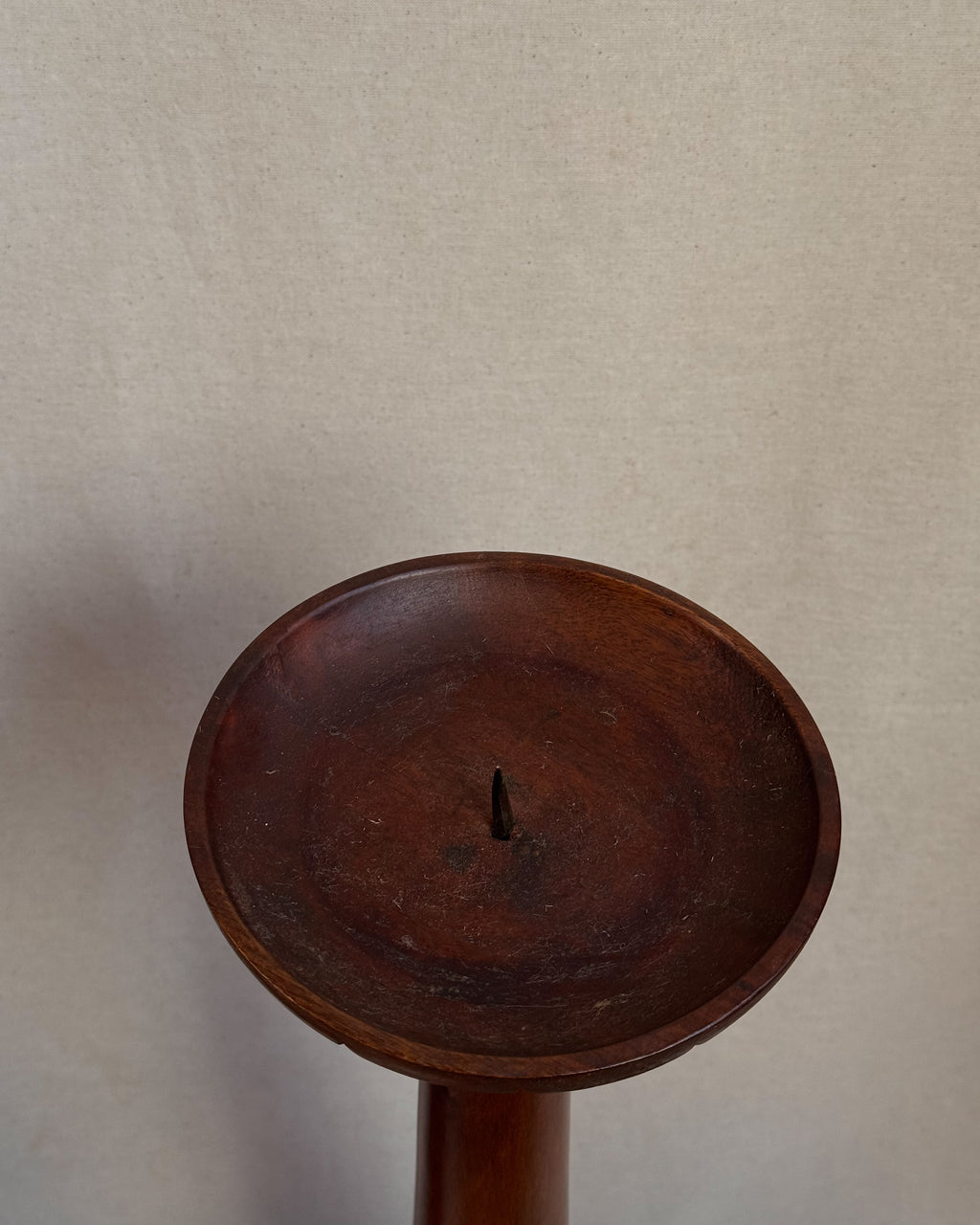 Carved wooden candle holders with canele shaped bases