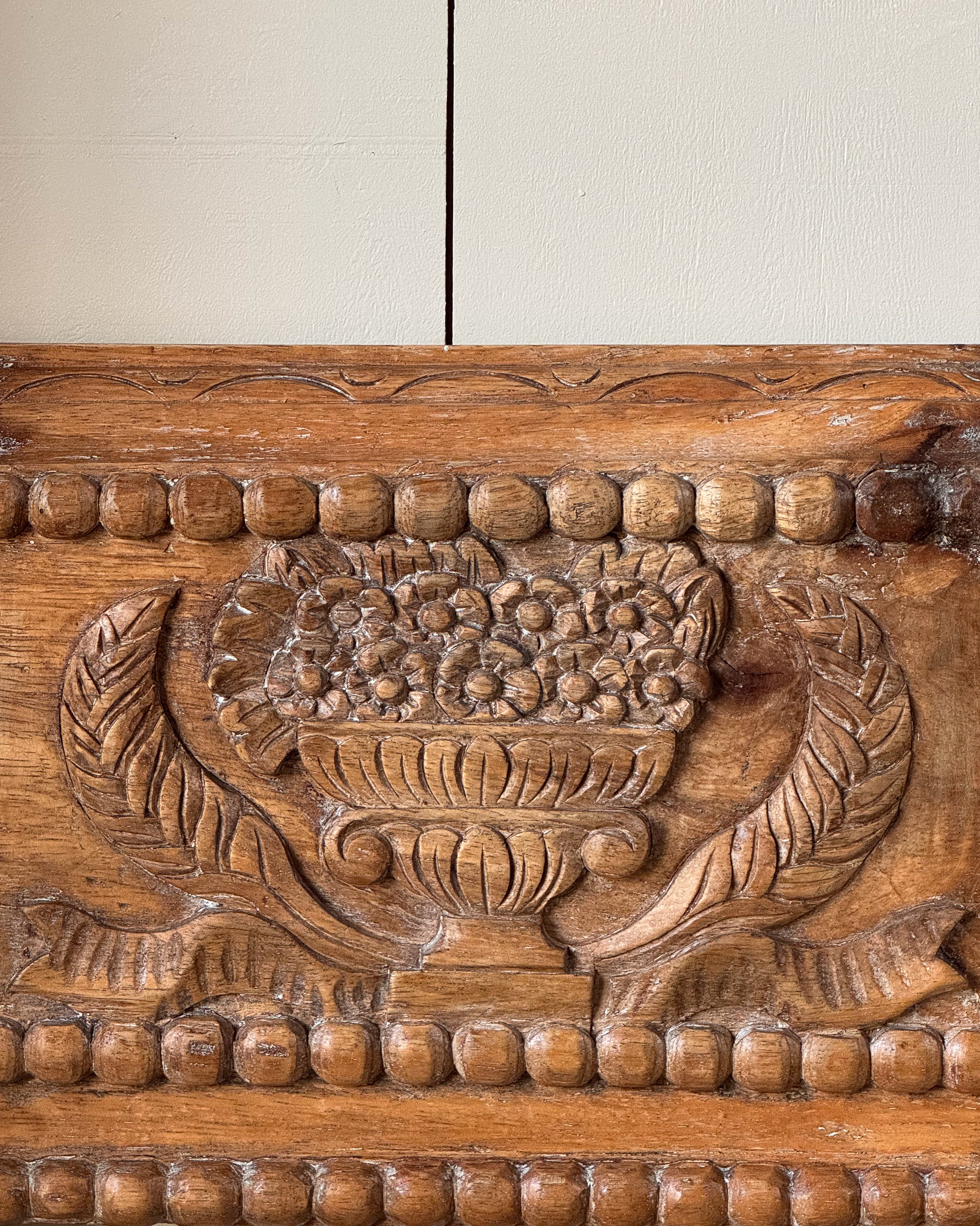 Hand carved wooden picture/mirror frame with clasical urn of flowers