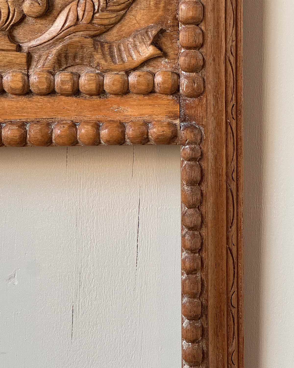 Hand carved wooden picture/mirror frame with clasical urn of flowers