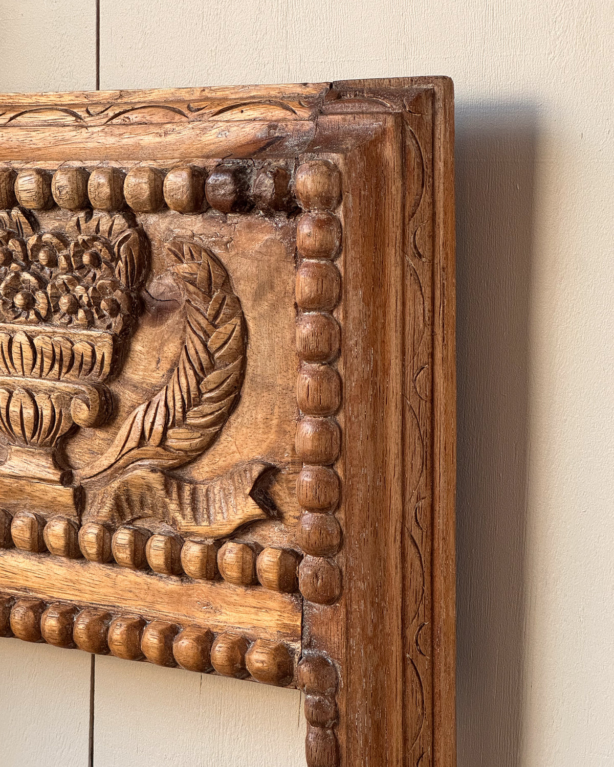 Hand carved wooden picture/mirror frame with clasical urn of flowers