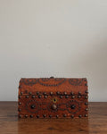 Wooden box wrapped in leather and stud detailing