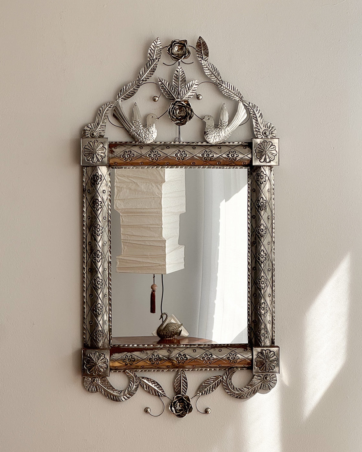 Mexican folk art punched tin mirror with birds and florals