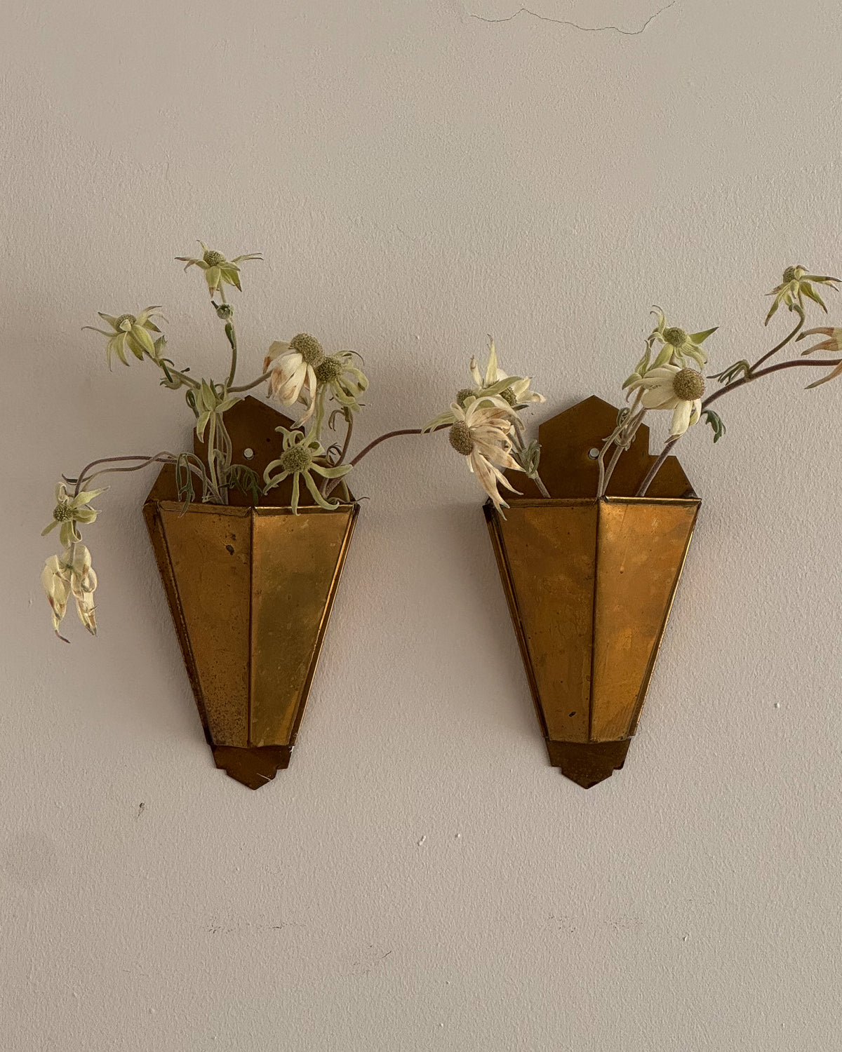 Pair of art deco style brass wall vases