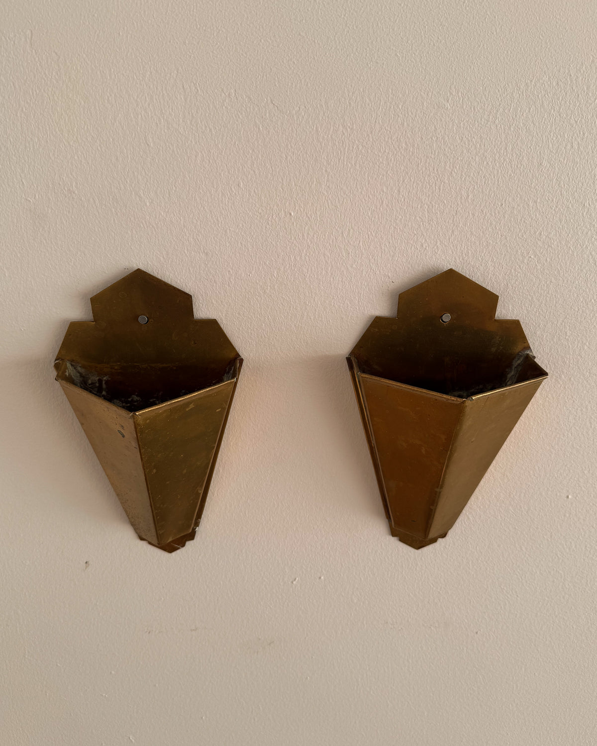 Pair of art deco style brass wall vases