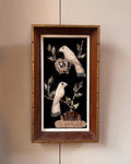 Shell bird art in wooden frame
