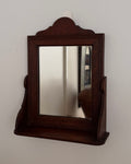 Dark wooden vanity or wall hanging mirror with ledge