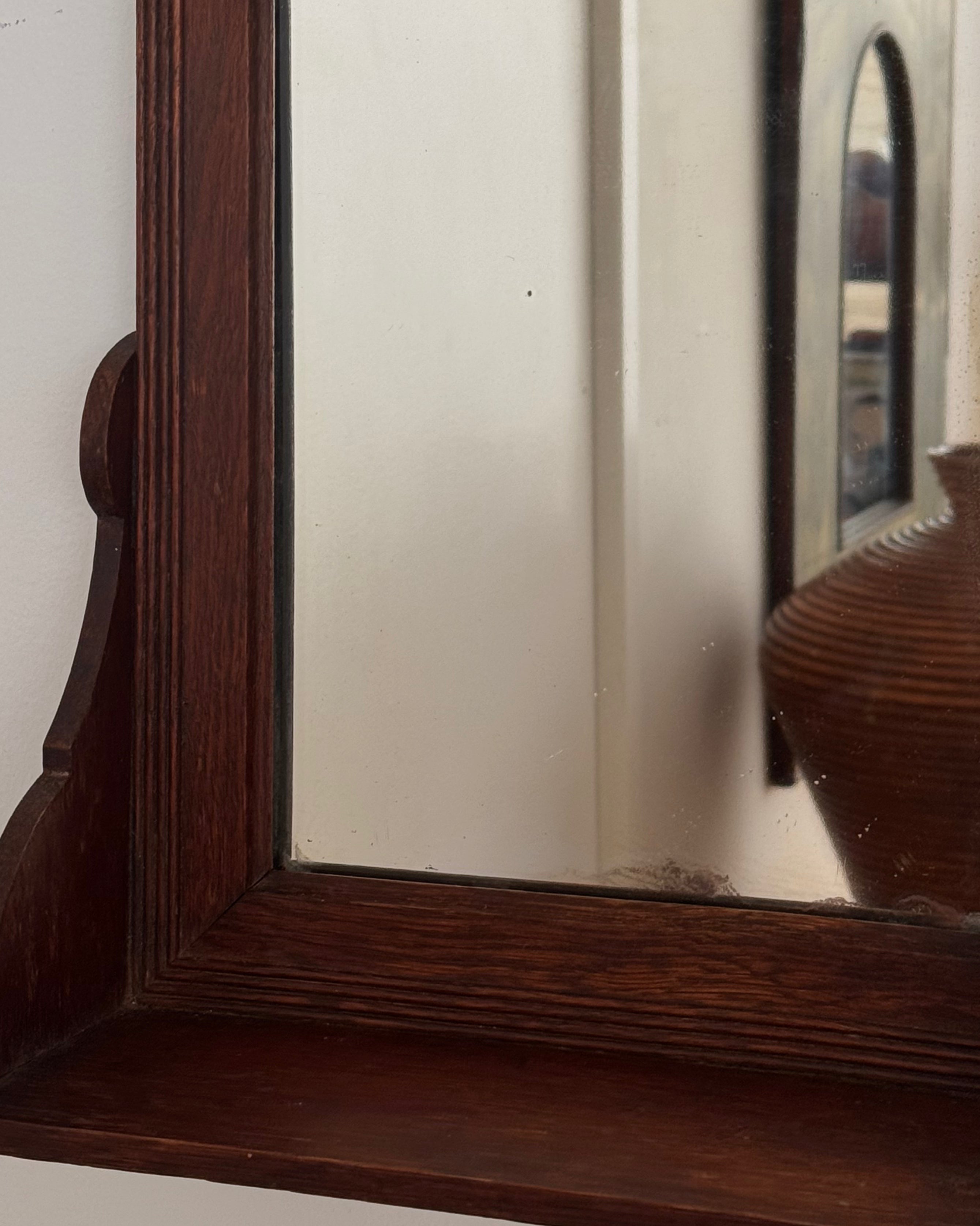 Dark wooden vanity or wall hanging mirror with ledge