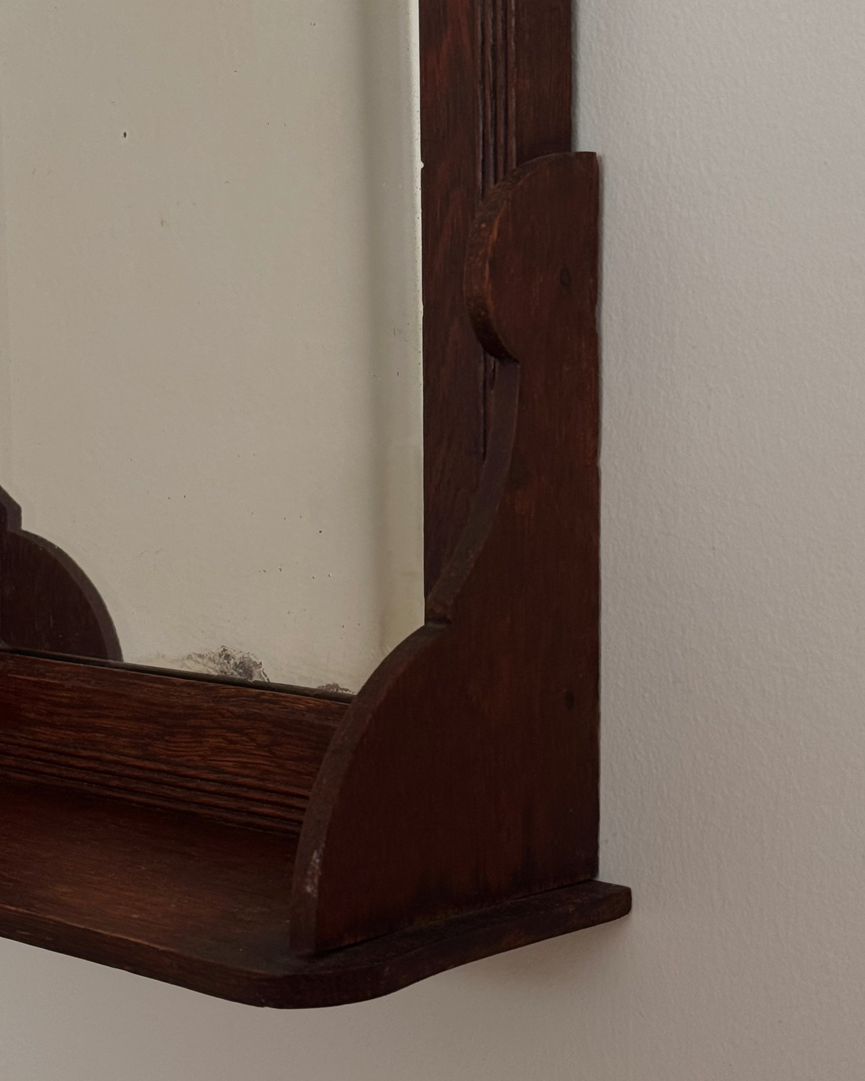 Dark wooden vanity or wall hanging mirror with ledge