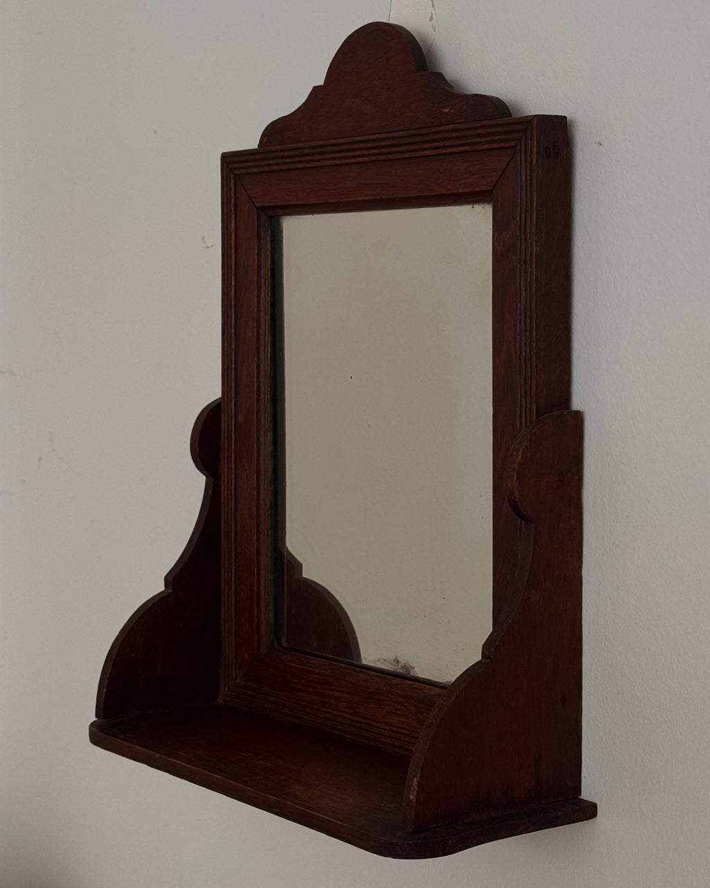 Dark wooden vanity or wall hanging mirror with ledge