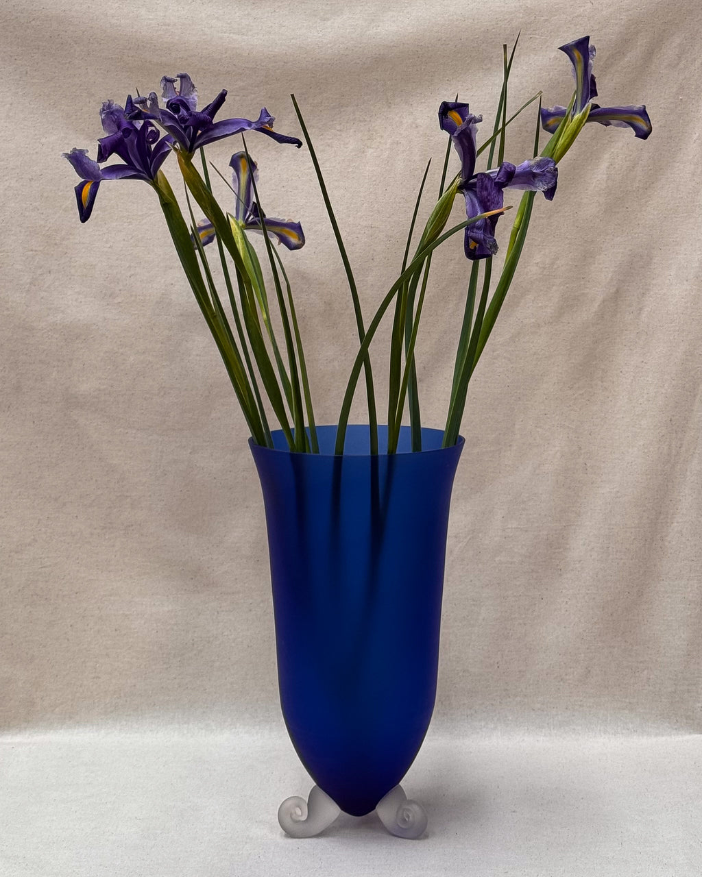 Blue art glass vase with spiral feet