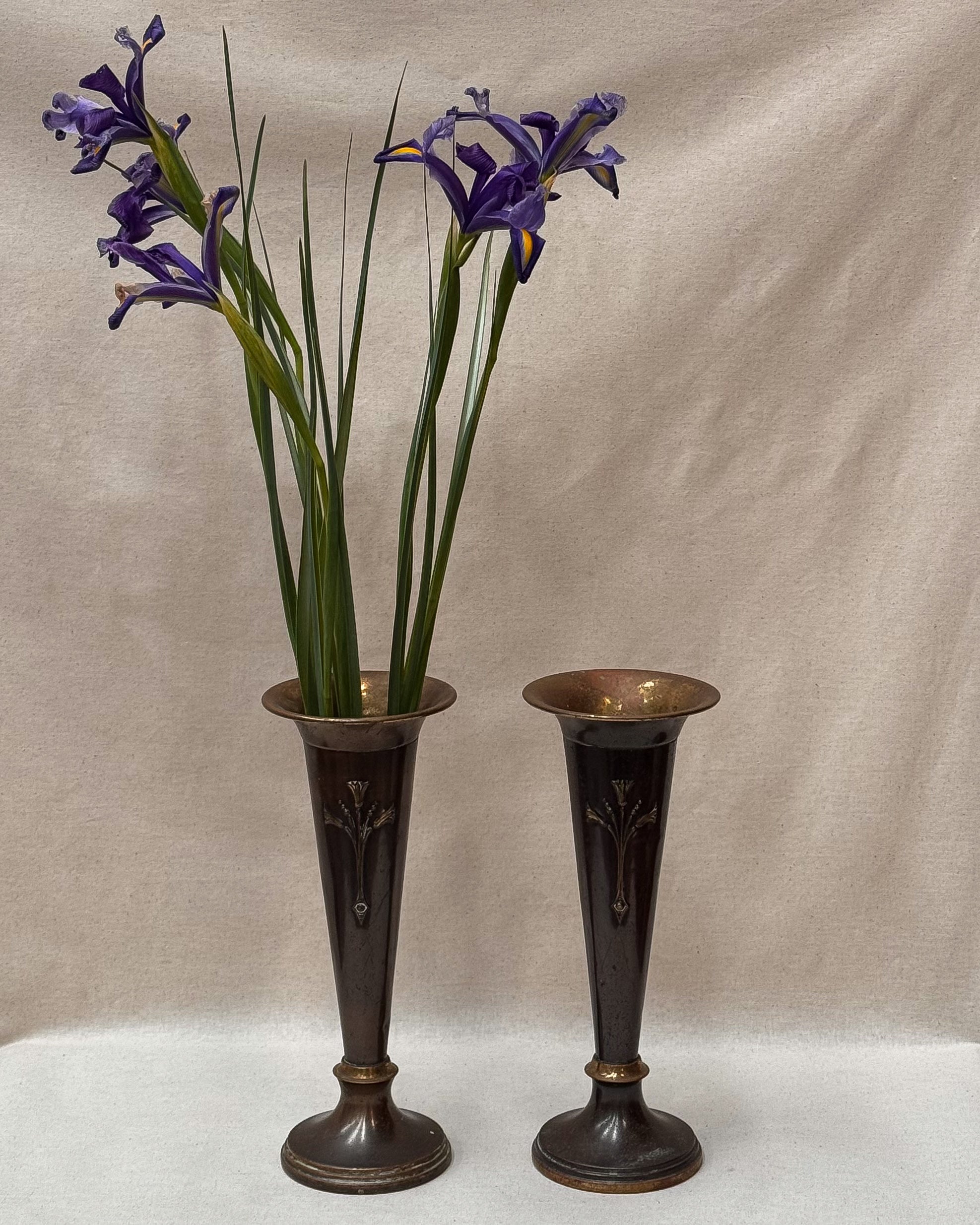 Pair of English Art Nouveau solid brass vases