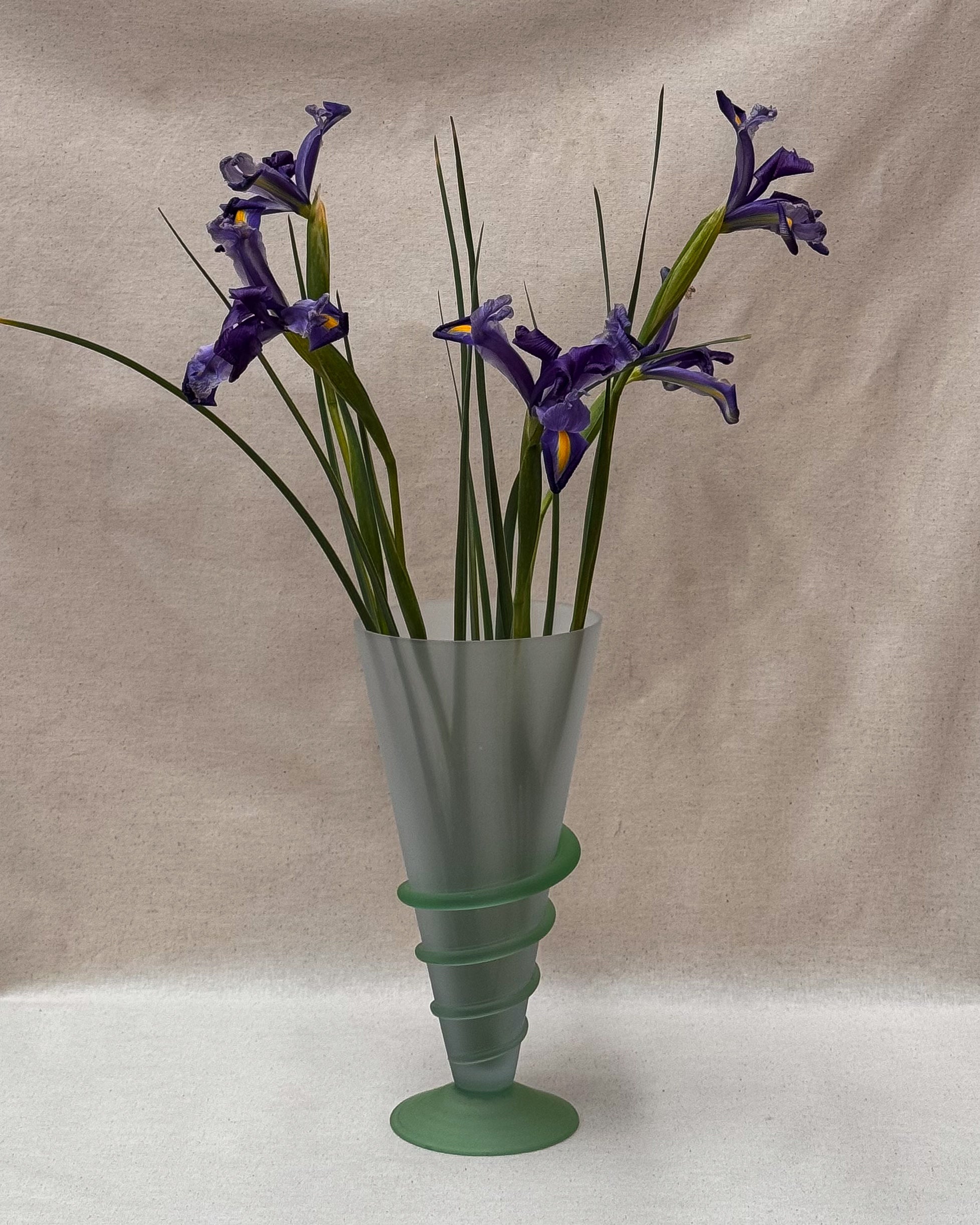 Art glass translucent vase with light green base and swirl detail