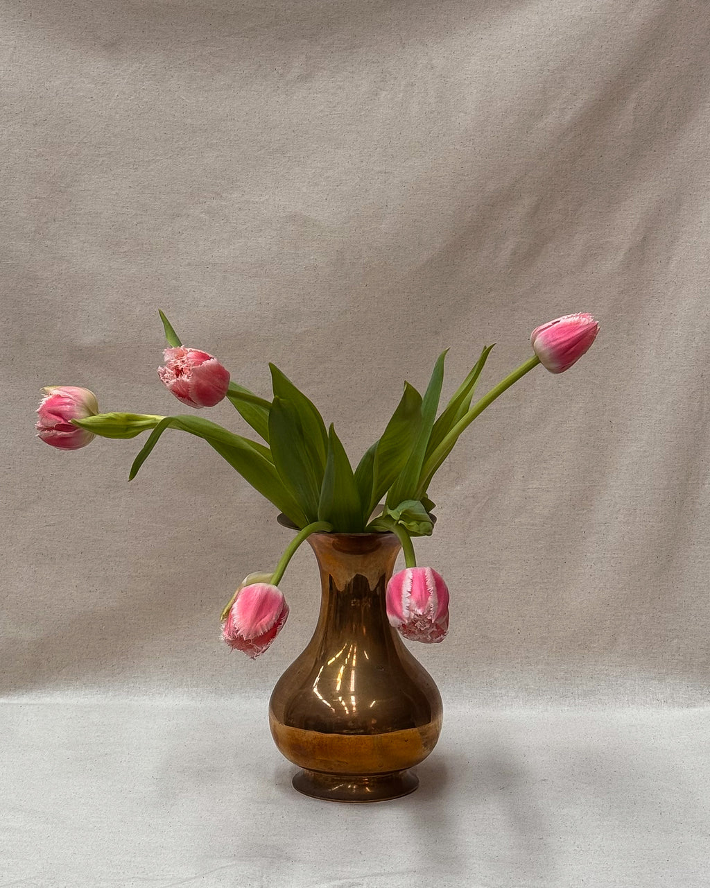 Tall rounded solid brass vase