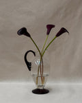 Glass pitcher vase with star like dark purple handle
