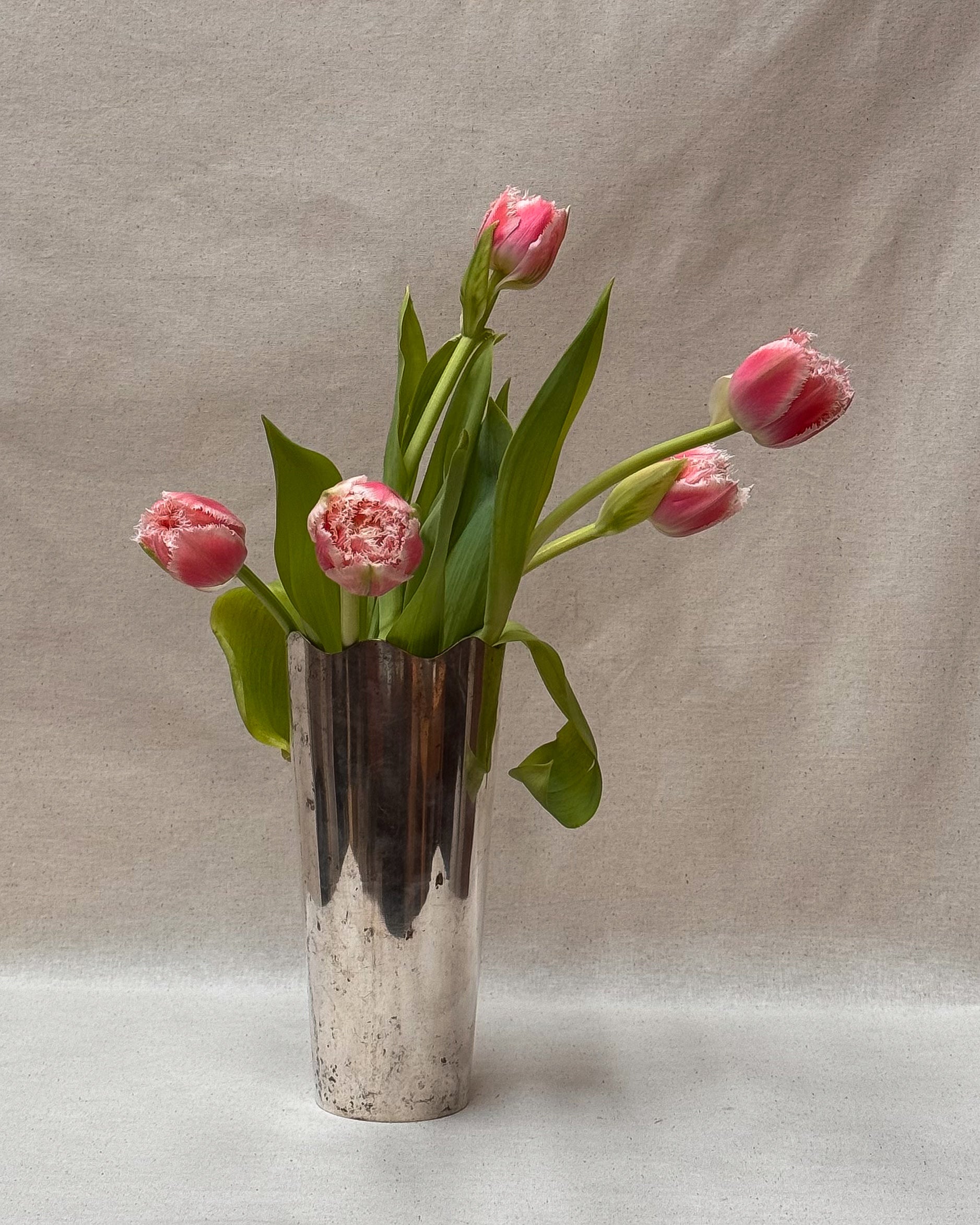 Silver plated vase with wavy opening
