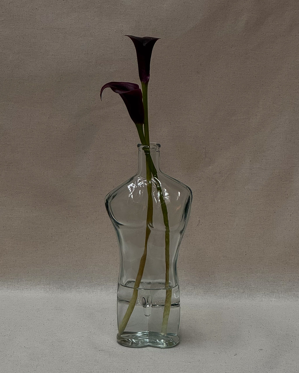 Male torso glass bottle with stopper