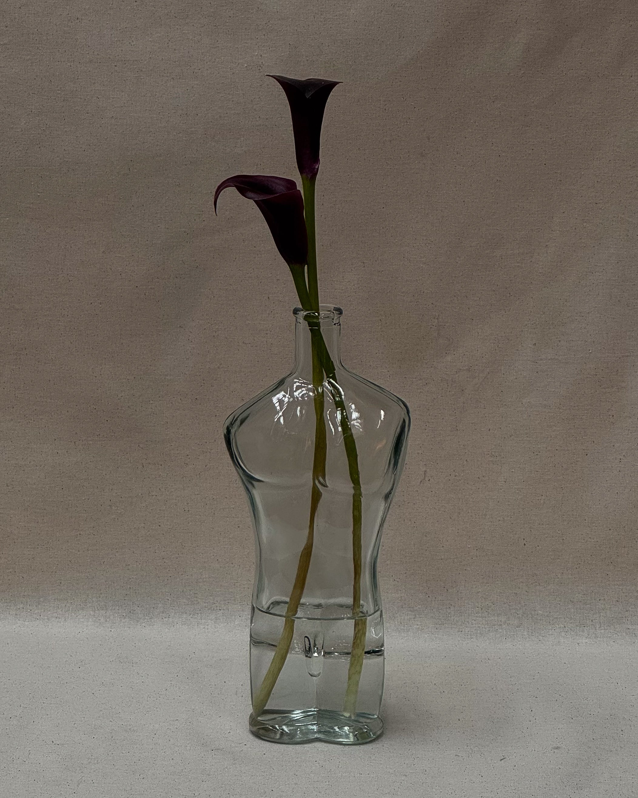 Male torso glass bottle with stopper