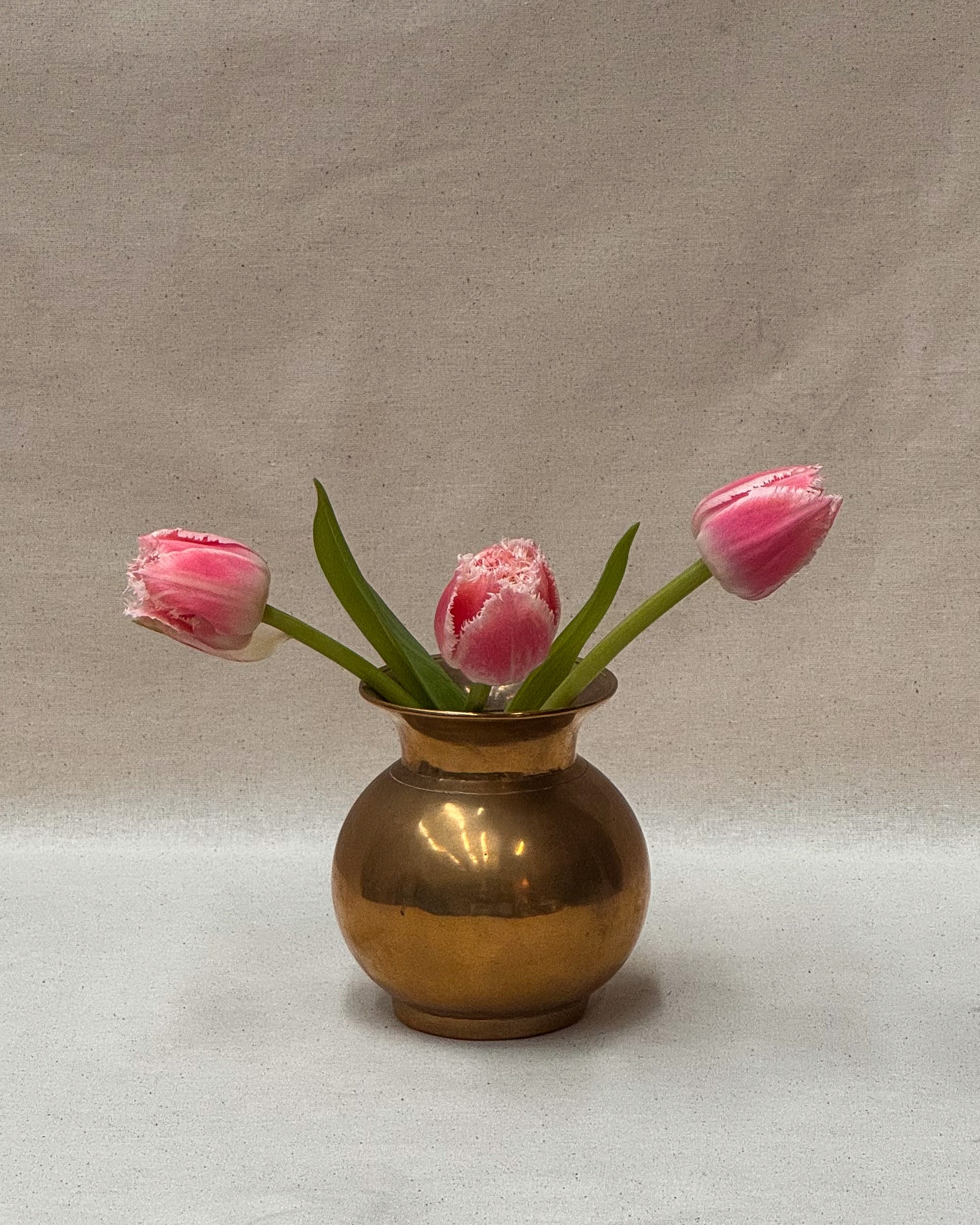 Short rounded solid brass vase