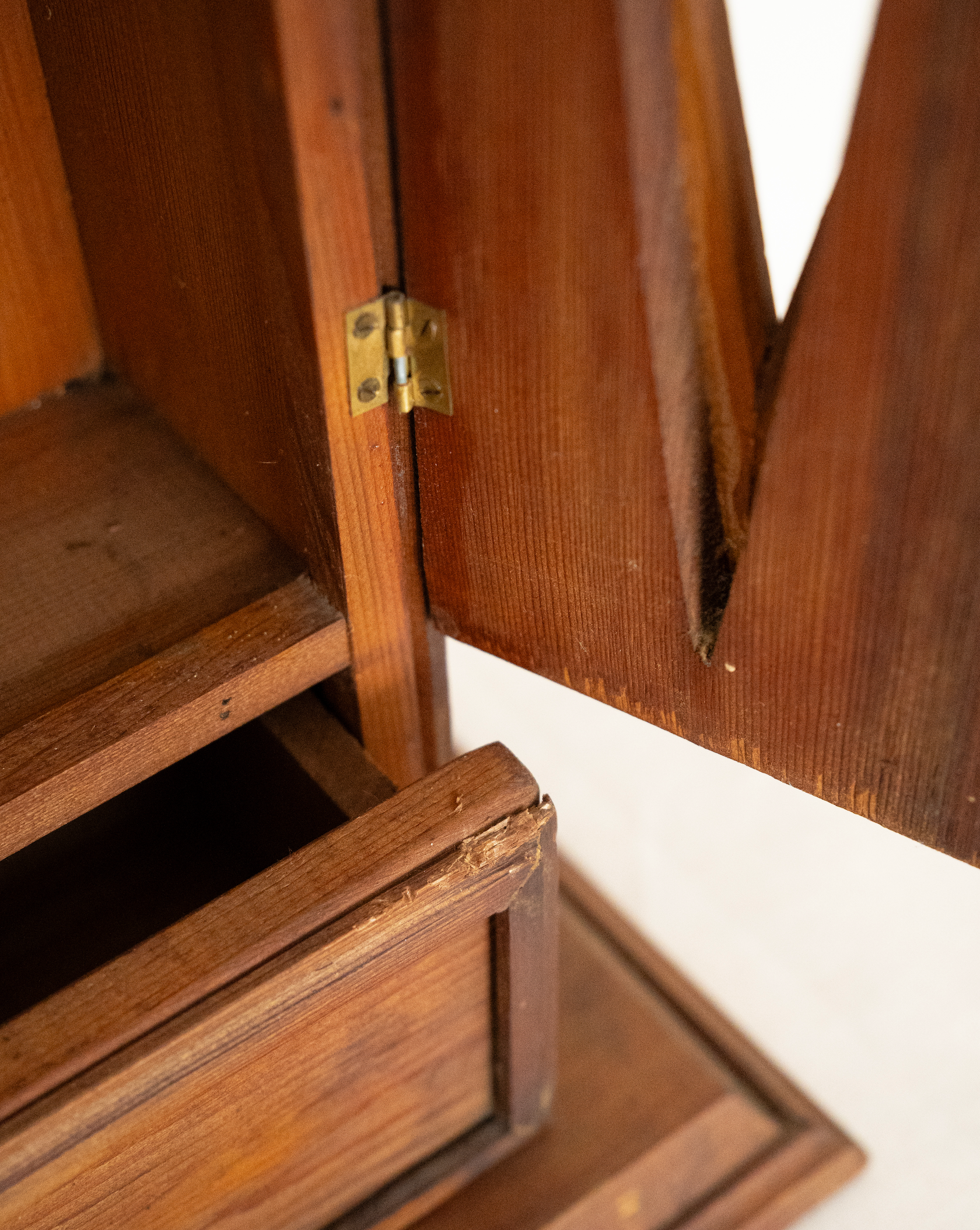 Wooden gothic style cabinet with shelving, two doors and a drawer
